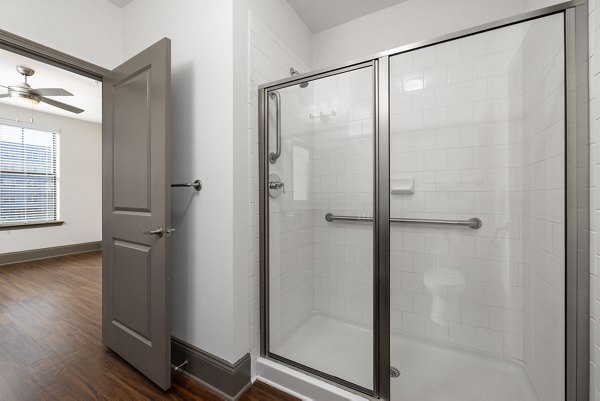 Bathroom featuring sleek fixtures and modern design at Midtown Green Apartments