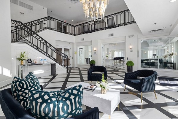 Clubhouse featuring modern lounge seating and entertainment area at Midtown Green Apartments