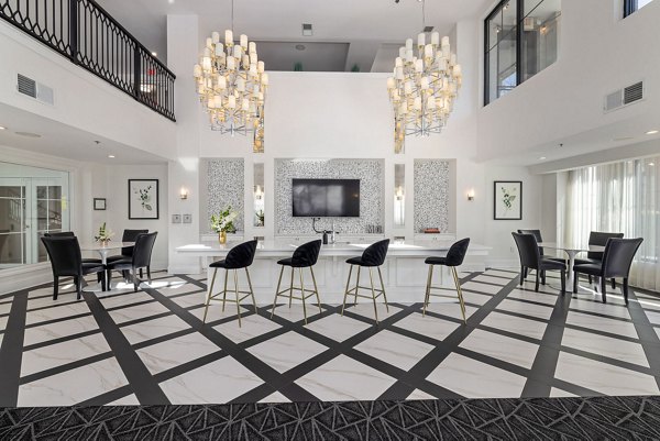 Clubhouse featuring modern decor and lounge seating at Midtown Green Apartments in luxury community