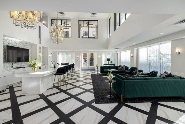 Clubhouse featuring modern design and spacious lounge area at Midtown Green Apartments