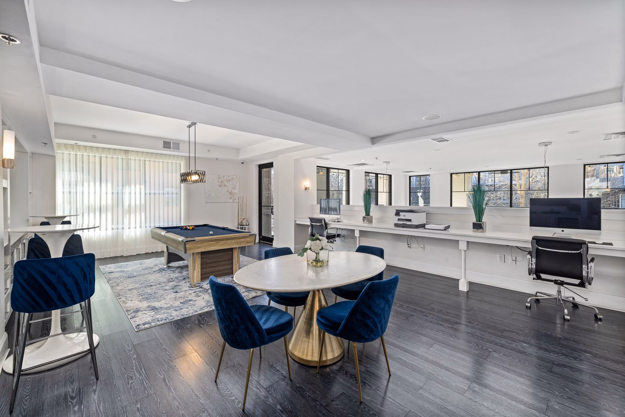 Stylish clubhouse with comfy seating and pool table at Midtown Green Apartments