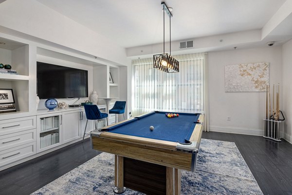 Clubhouse featuring modern furnishings and social spaces at Midtown Green Apartments, a luxury community by Greystar in the heart of the city