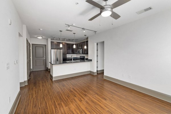 Modern kitchen with stainless steel appliances in Midtown Green Apartments