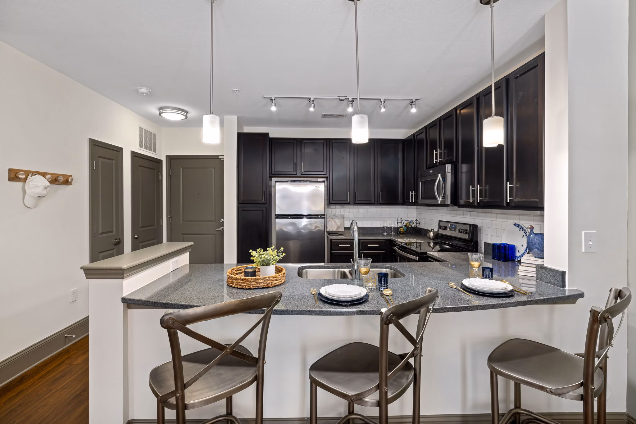 Modern kitchen with stainless steel appliances at Midtown Green Apartments