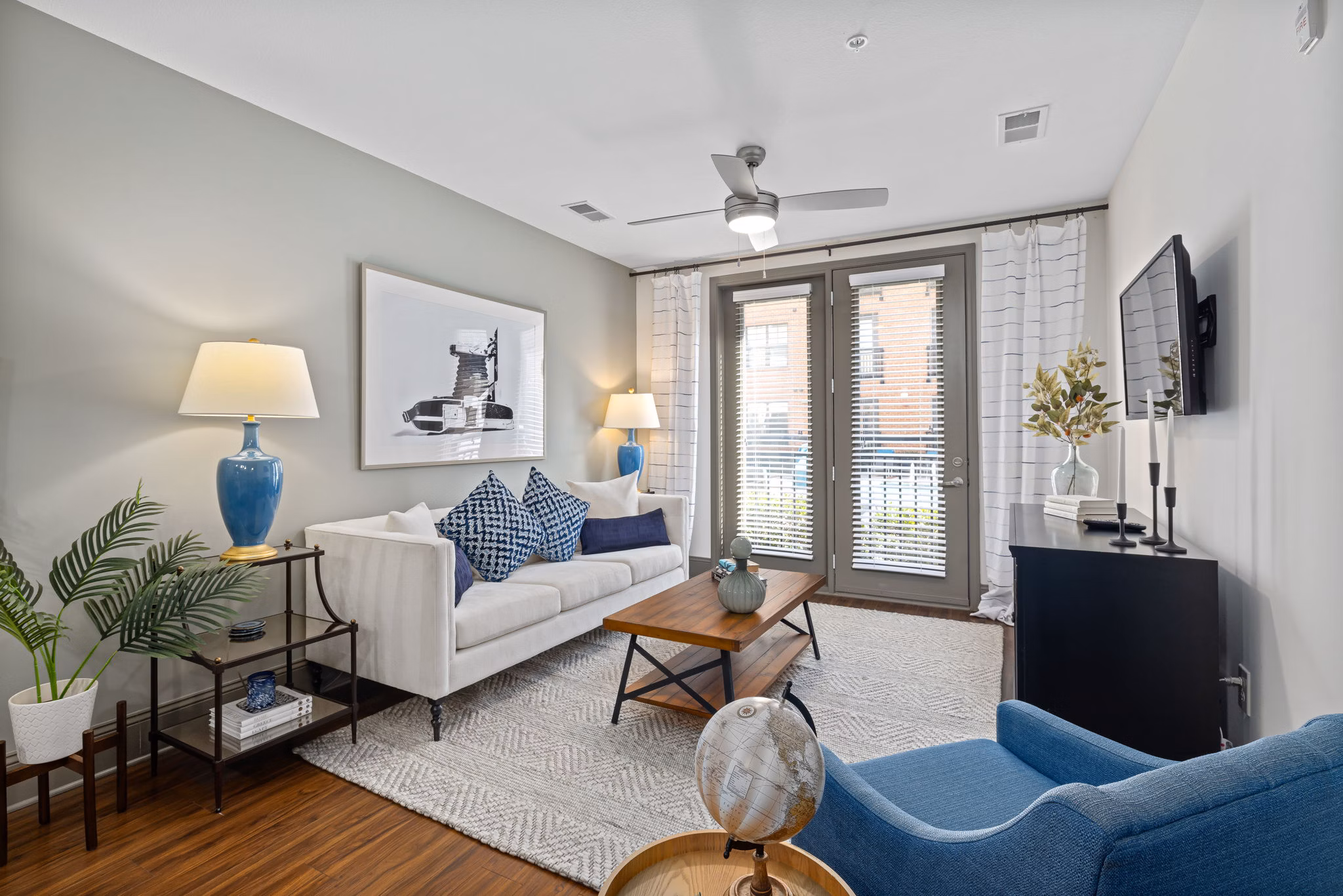 Spacious living room with modern decor in Midtown Green Apartments, luxury apartments by Greystar