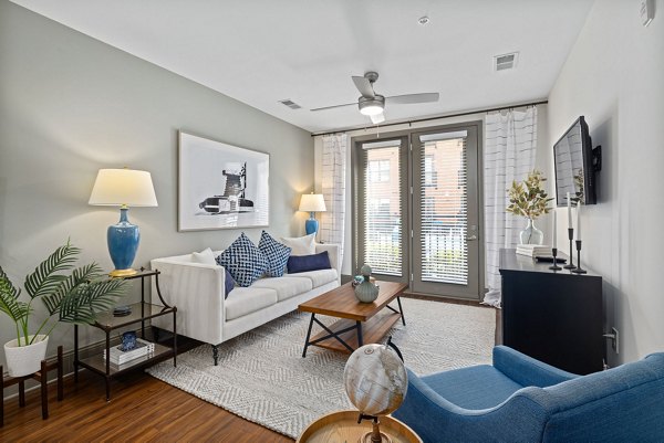 Spacious living room with modern decor in Midtown Green Apartments, luxury apartments by Greystar