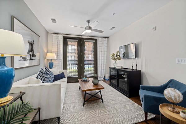 Modern living room with stylish furniture at Midtown Green Apartments, spacious design for luxury living in a prime location