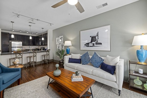 Spacious living room with modern decor at Midtown Green Apartments