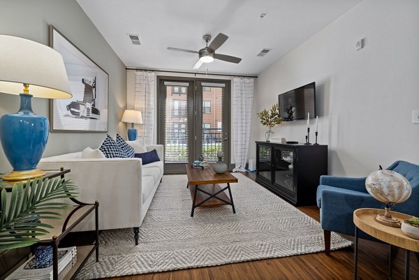 Cozy living room with modern decor at Midtown Green Apartments