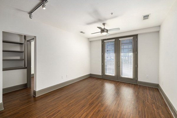 Elegant living room with modern furnishings at Midtown Green Apartments in luxury Greystar community