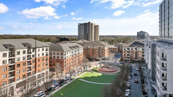 Midtown Green Apartments: Scenic view of lush green courtyards and modern architecture at luxury residences in vibrant city setting