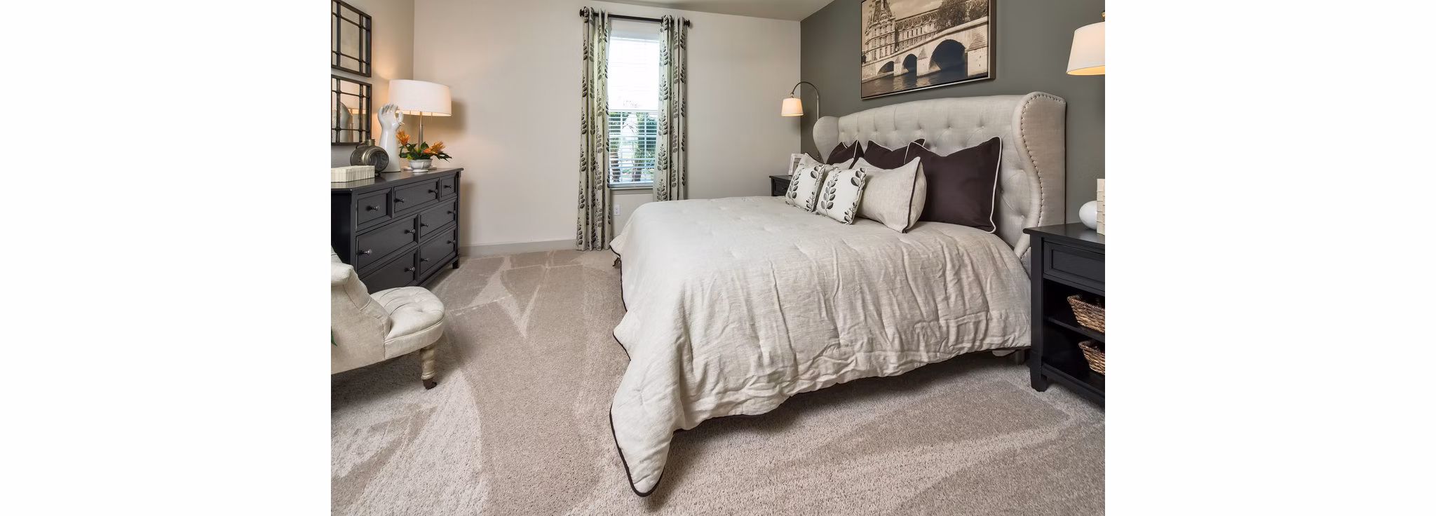 Modern bedroom with natural light and cozy furnishings at The Retreat at Trinity Apartments