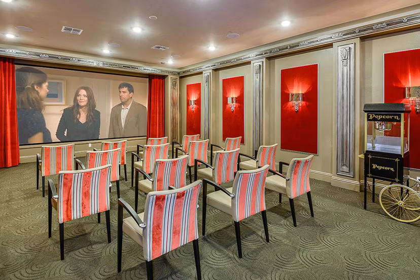 Modern theater with comfortable seating at The Retreat at Trinity Apartments in a luxurious Greystar community