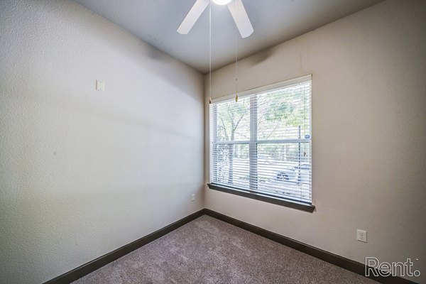Bedroom featuring elegant decor and large windows in The Millennium Waterway luxury apartments