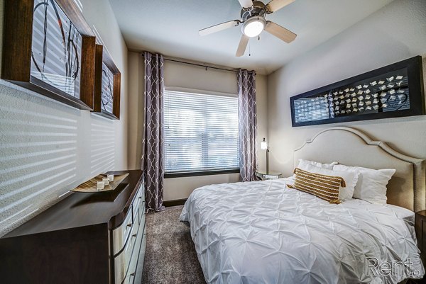 Bedroom featuring stylish modern decor in The Millennium Waterway apartments