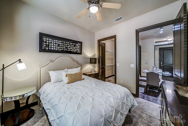 Cozy bedroom with stylish decor at The Millennium Waterway apartments
