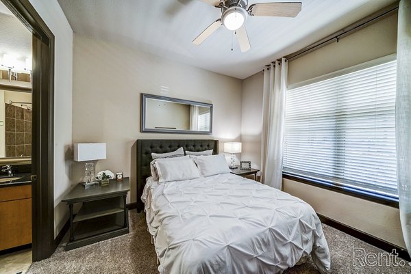 Modern bedroom with elegant furnishings at The Millennium Waterway apartments