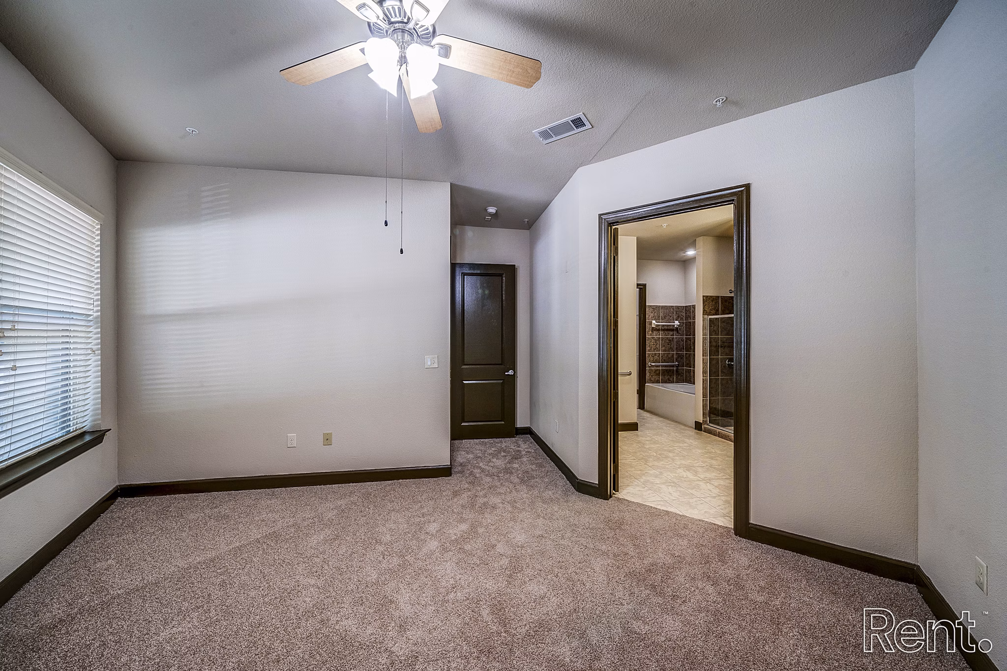 Modern bedroom featuring elegant decor and large windows at The Millennium Waterway luxury apartments