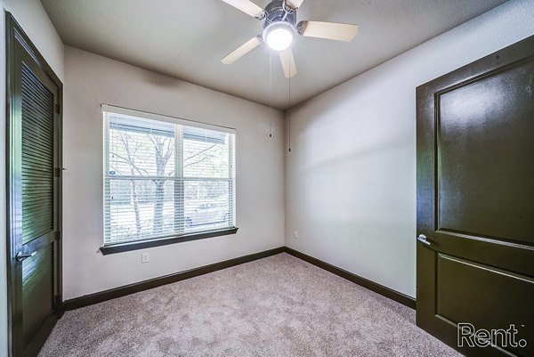 Modern bedroom featuring stylish decor and natural light at The Millennium Waterway luxury apartments