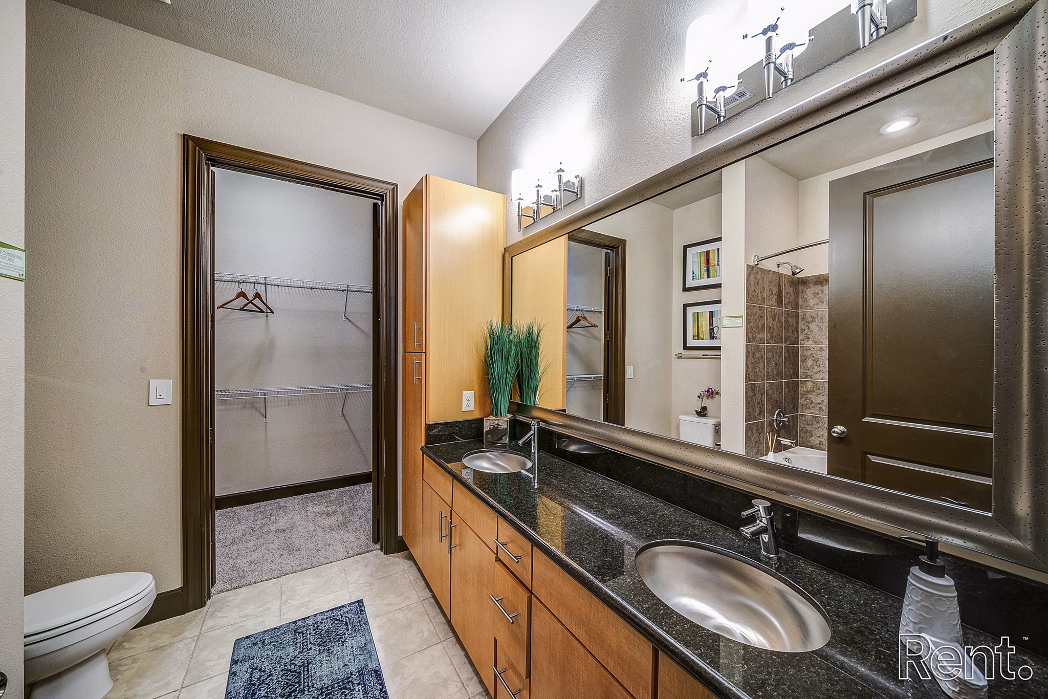 Bathroom featuring elegant design with marble countertops at The Millennium Waterway luxury apartments