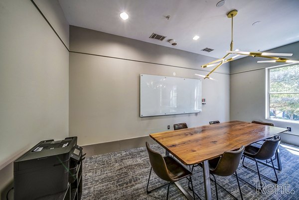 Modern meeting facility with advanced tech equipment at The Millennium Waterway luxury apartments