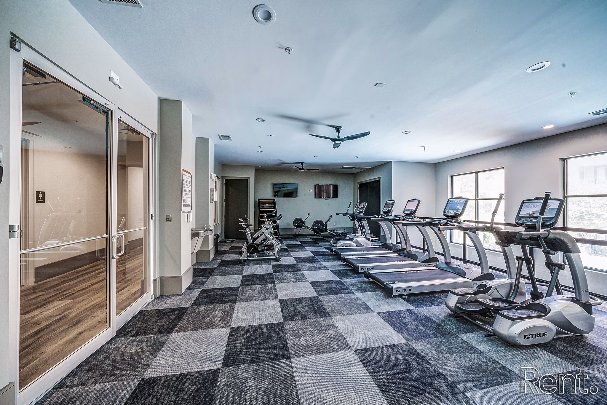 State-of-the-art fitness center featuring modern equipment at The Millennium Waterway apartments in The Woodlands