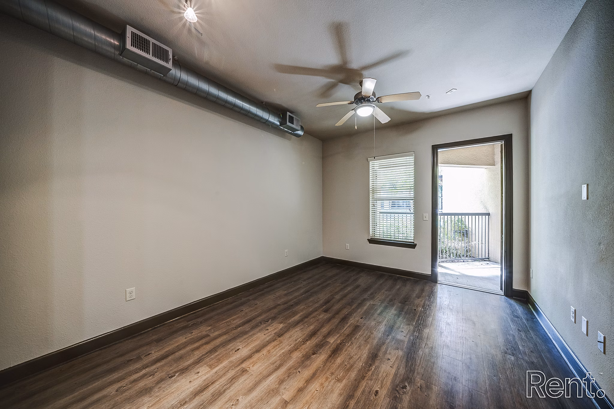 Spacious living room with modern decor at The Millennium Waterway apartments