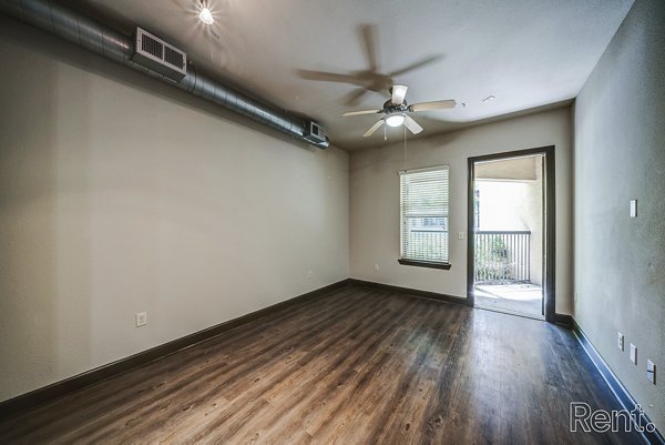 Spacious living room with modern decor at The Millennium Waterway apartments