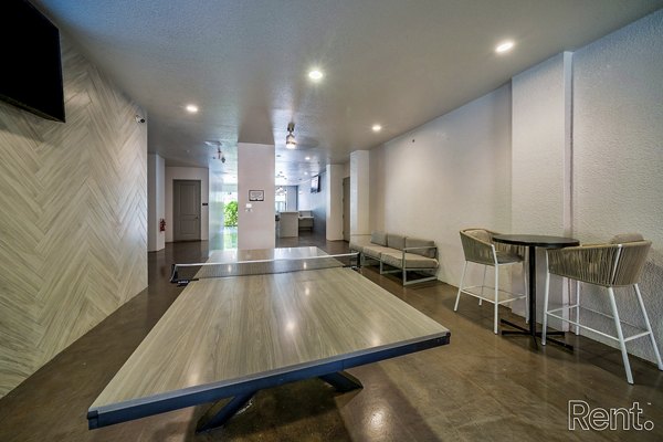 Spacious outdoor patio at The Millennium Waterway, perfect for relaxation and gatherings in a luxury apartment community