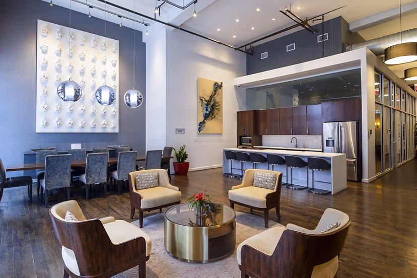 Modern rooftop deck with seating and city views at The Rice Apartments, luxury living in an upscale urban setting