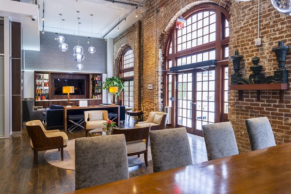 Clubhouse with modern furnishings and entertainment options at The Rice Apartments
