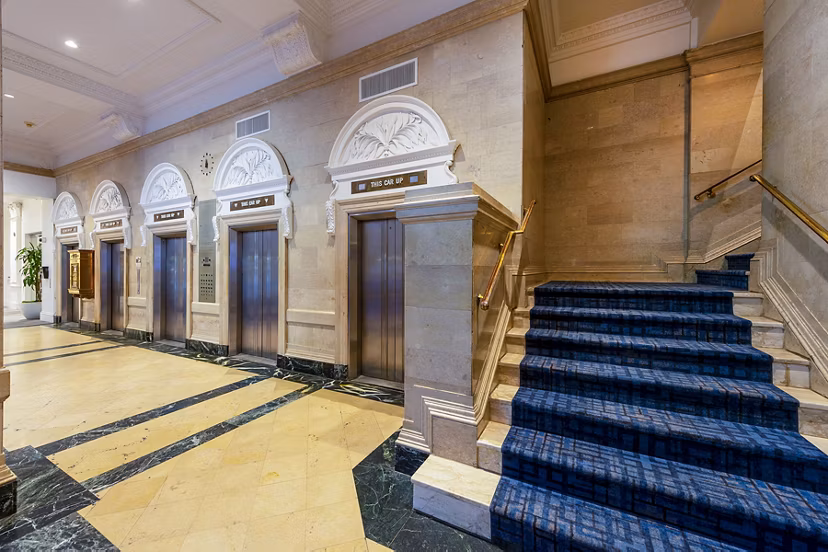 Elegant clubhouse with modern design at The Rice Apartments, perfect for social gatherings and leisure activities