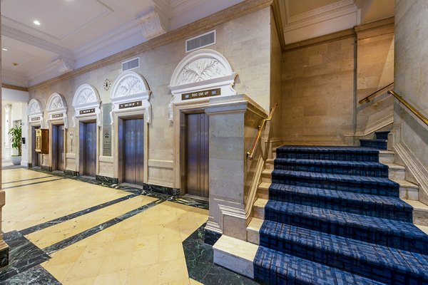 Elegant clubhouse with modern design at The Rice Apartments, perfect for social gatherings and leisure activities