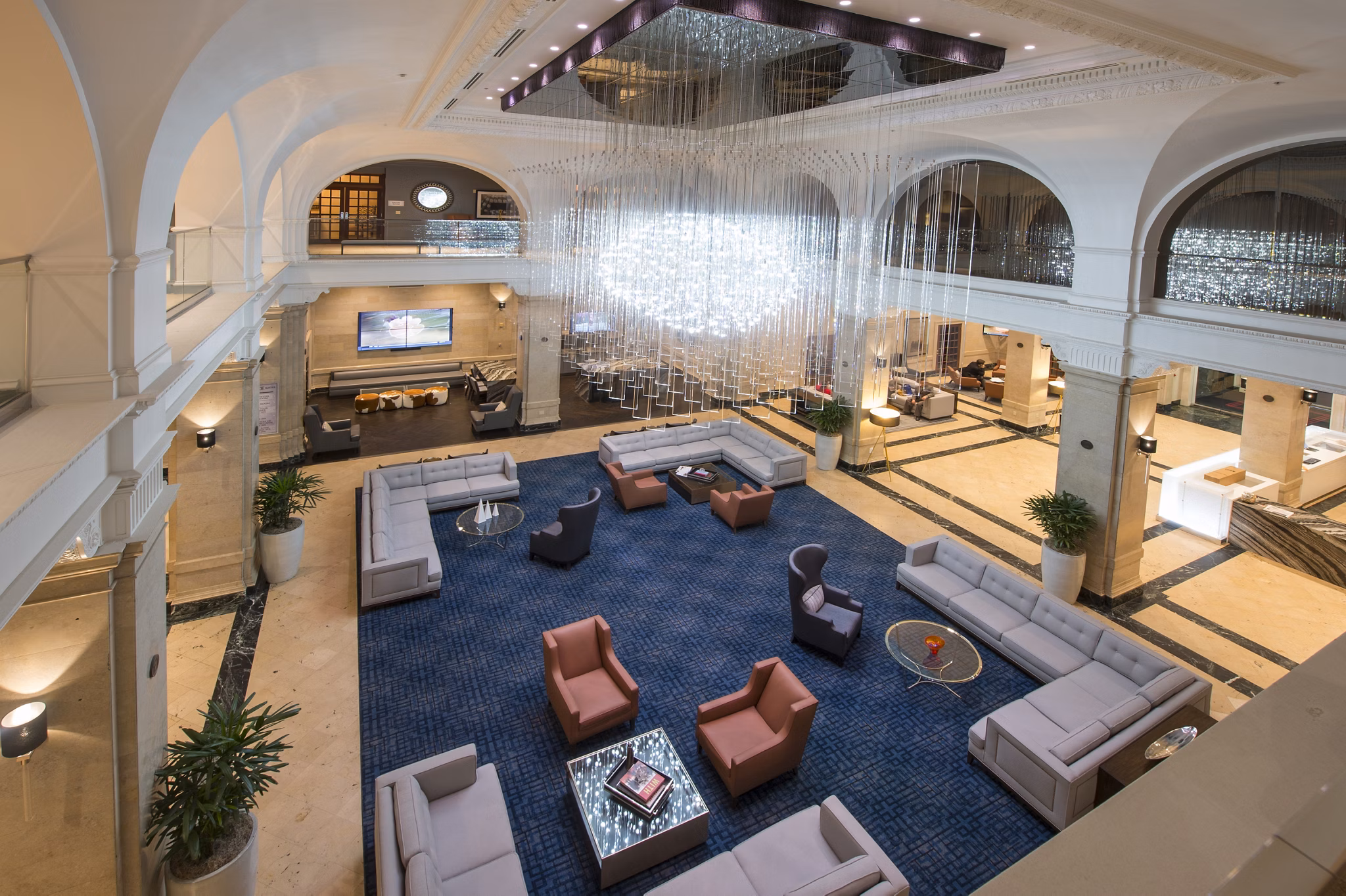Elegant clubhouse with stylish seating and modern lighting at The Rice Apartments, ideal for gatherings and social events in a luxury setting
