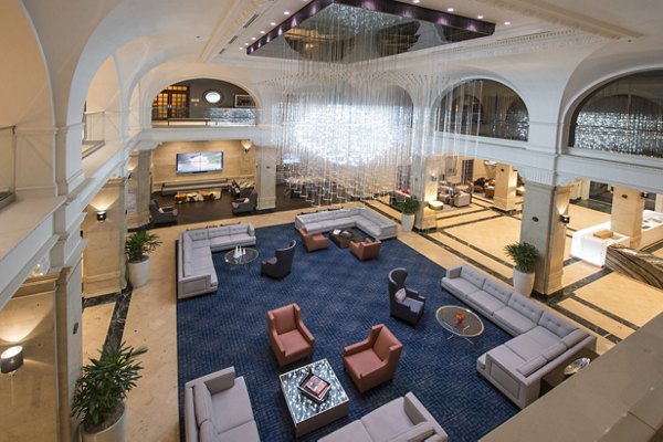Elegant clubhouse with stylish seating and modern lighting at The Rice Apartments, ideal for gatherings and social events in a luxury setting