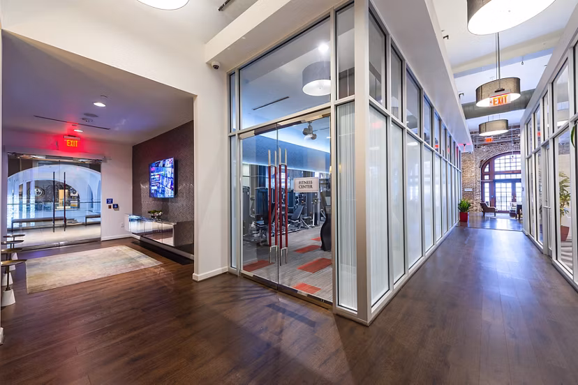 State-of-the-art fitness center at The Rice Apartments featuring modern equipment