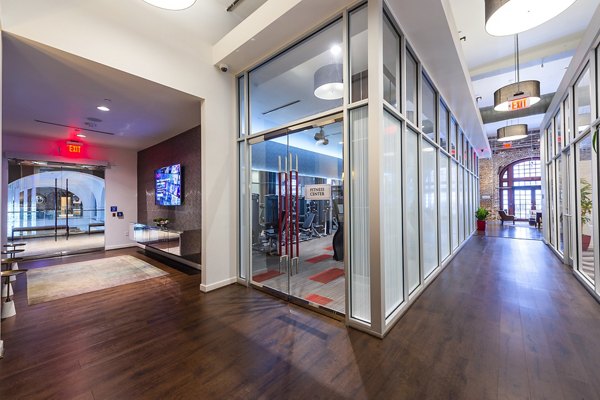 State-of-the-art fitness center at The Rice Apartments featuring modern equipment