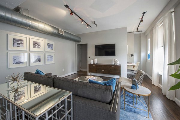 Spacious living room at The Rice Apartments featuring modern dÃ©cor and ample natural light