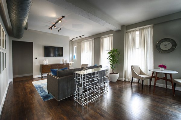 Spacious living room with modern decor at The Rice Apartments