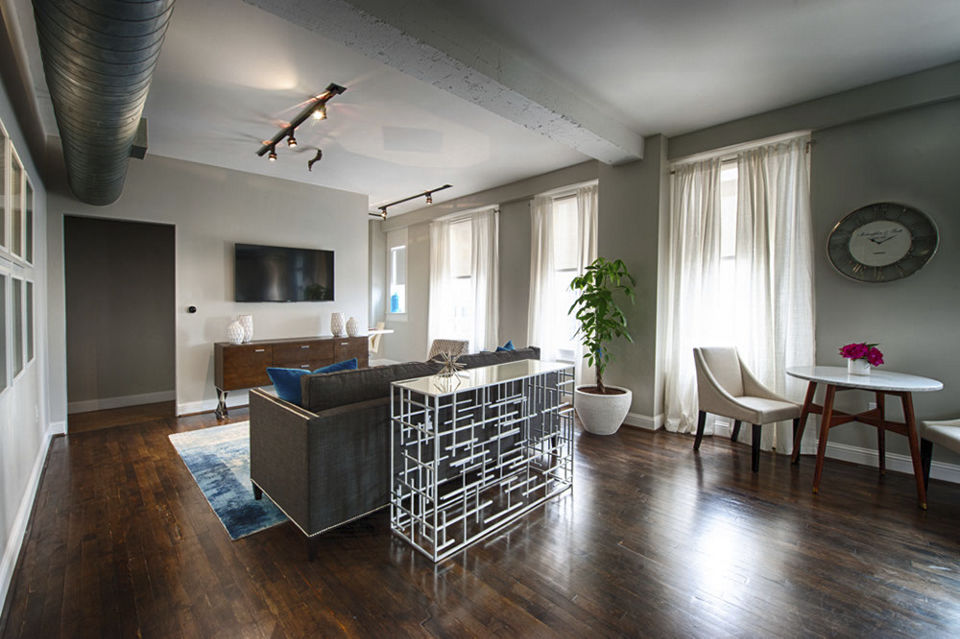 Spacious living room with modern decor at The Rice Apartments