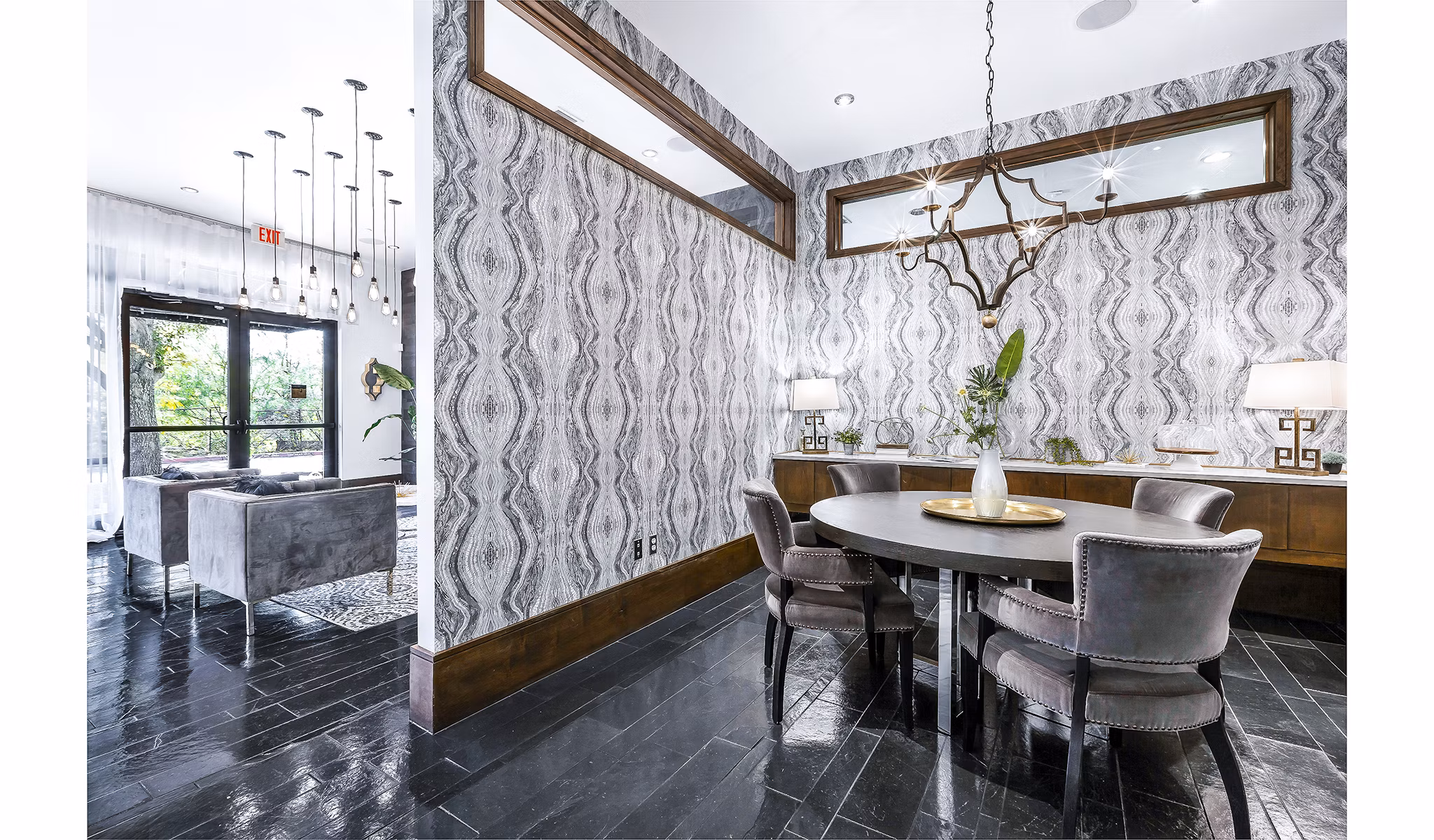 Modern clubhouse/lobby with comfortable seating at 5th Street Commons Apartments, a luxury property designed for contemporary living