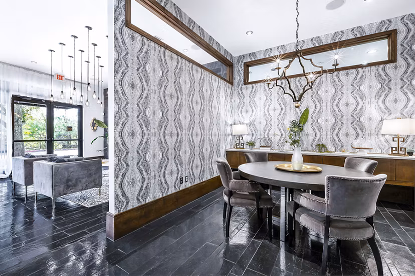 Modern clubhouse/lobby with comfortable seating at 5th Street Commons Apartments, a luxury property designed for contemporary living