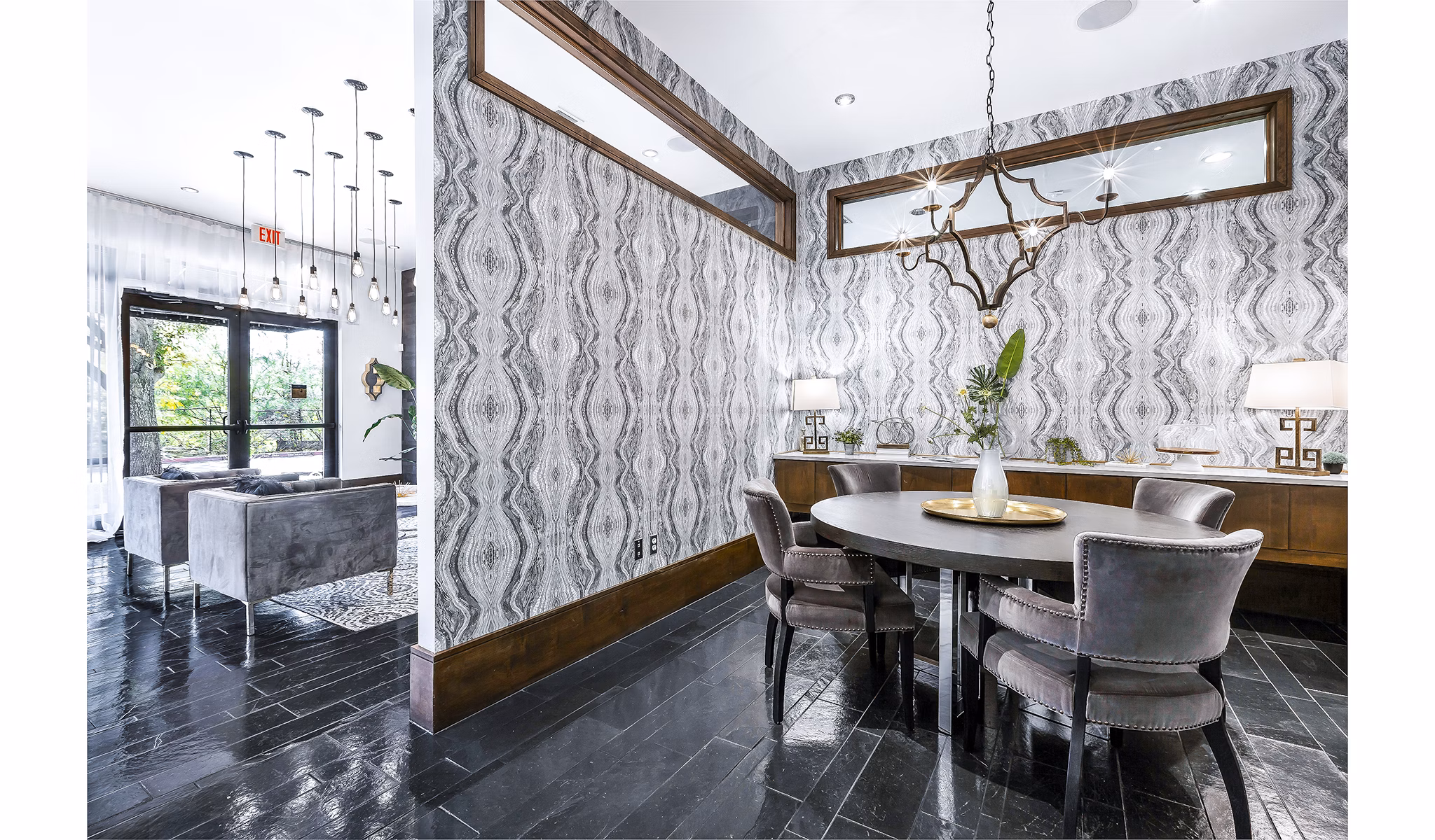 Modern clubhouse/lobby with comfortable seating at 5th Street Commons Apartments, a luxury property designed for contemporary living