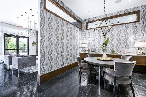 Modern clubhouse/lobby with comfortable seating at 5th Street Commons Apartments, a luxury property designed for contemporary living