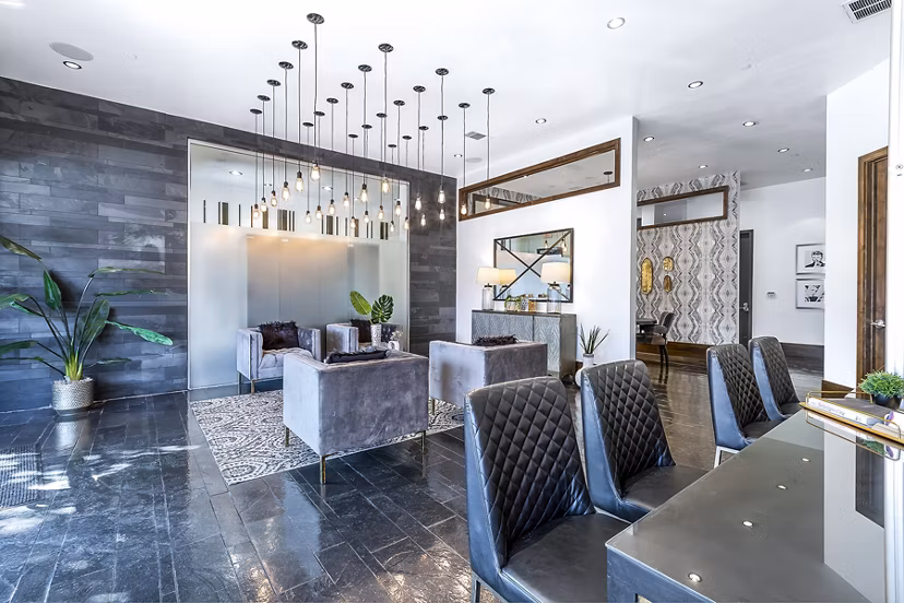 Modern clubhouse and leasing office at 5th Street Commons Apartments offering luxury amenities in an upscale community setting