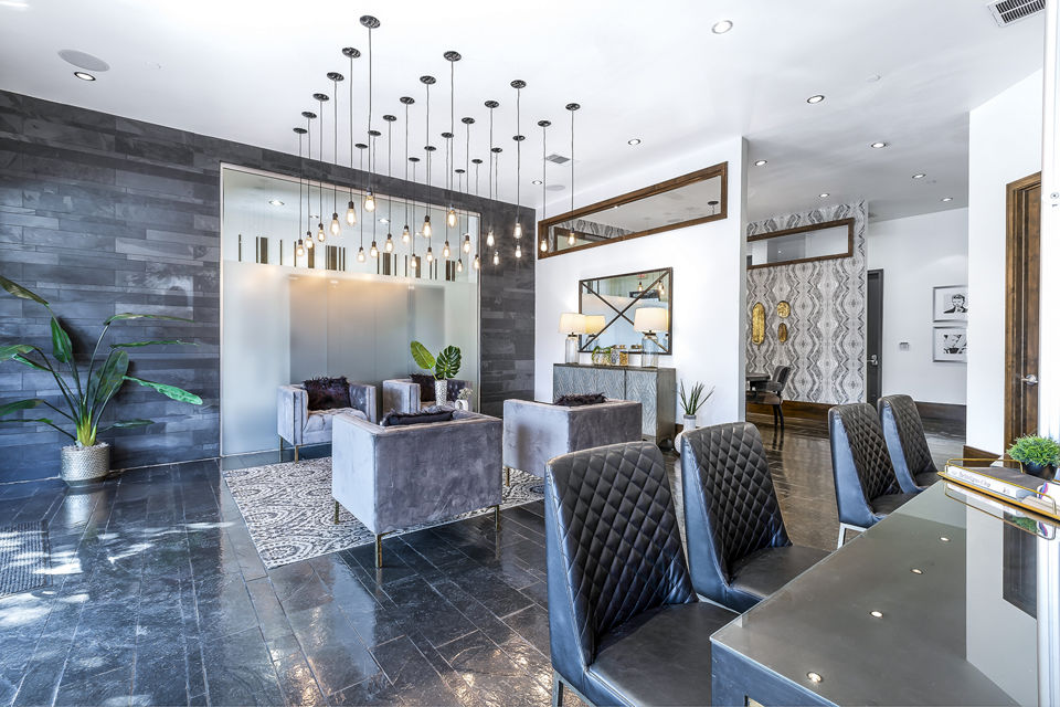 Modern clubhouse and leasing office at 5th Street Commons Apartments offering luxury amenities in an upscale community setting