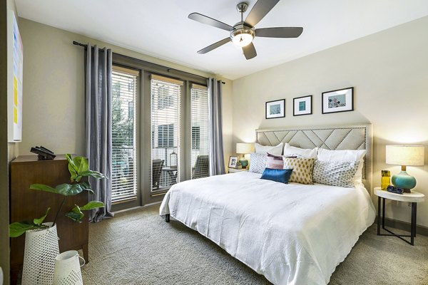 Cozy bedroom with modern decor in Pressler Apartments offering luxurious living in the heart of the city