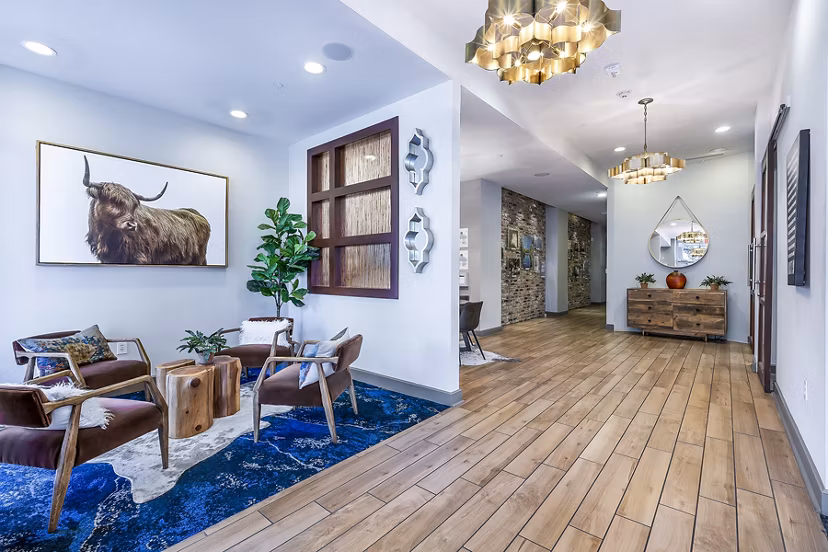 Clubhouse lobby with stylish furniture and modern design at Pressler Apartments, luxurious community in a vibrant urban setting