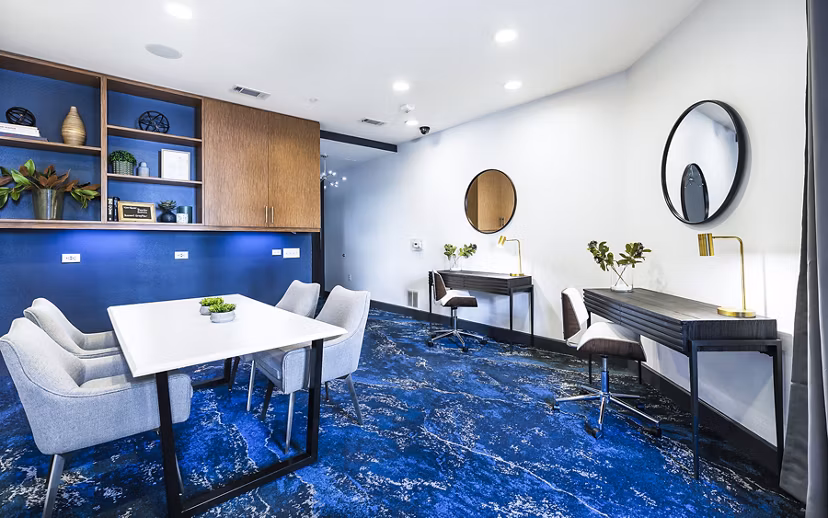 Clubhouse meeting facility with modern furnishings at Pressler Apartments, offering luxury spaces for gatherings and events