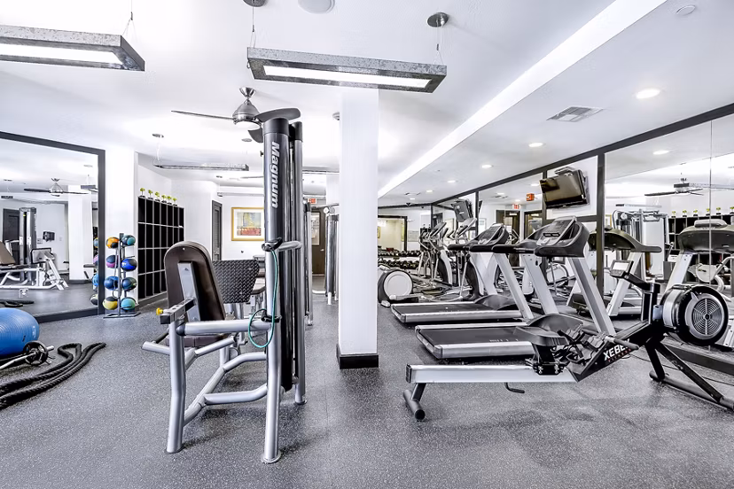 State-of-the-art fitness center with modern equipment at Pressler Apartments for active living in a luxurious community